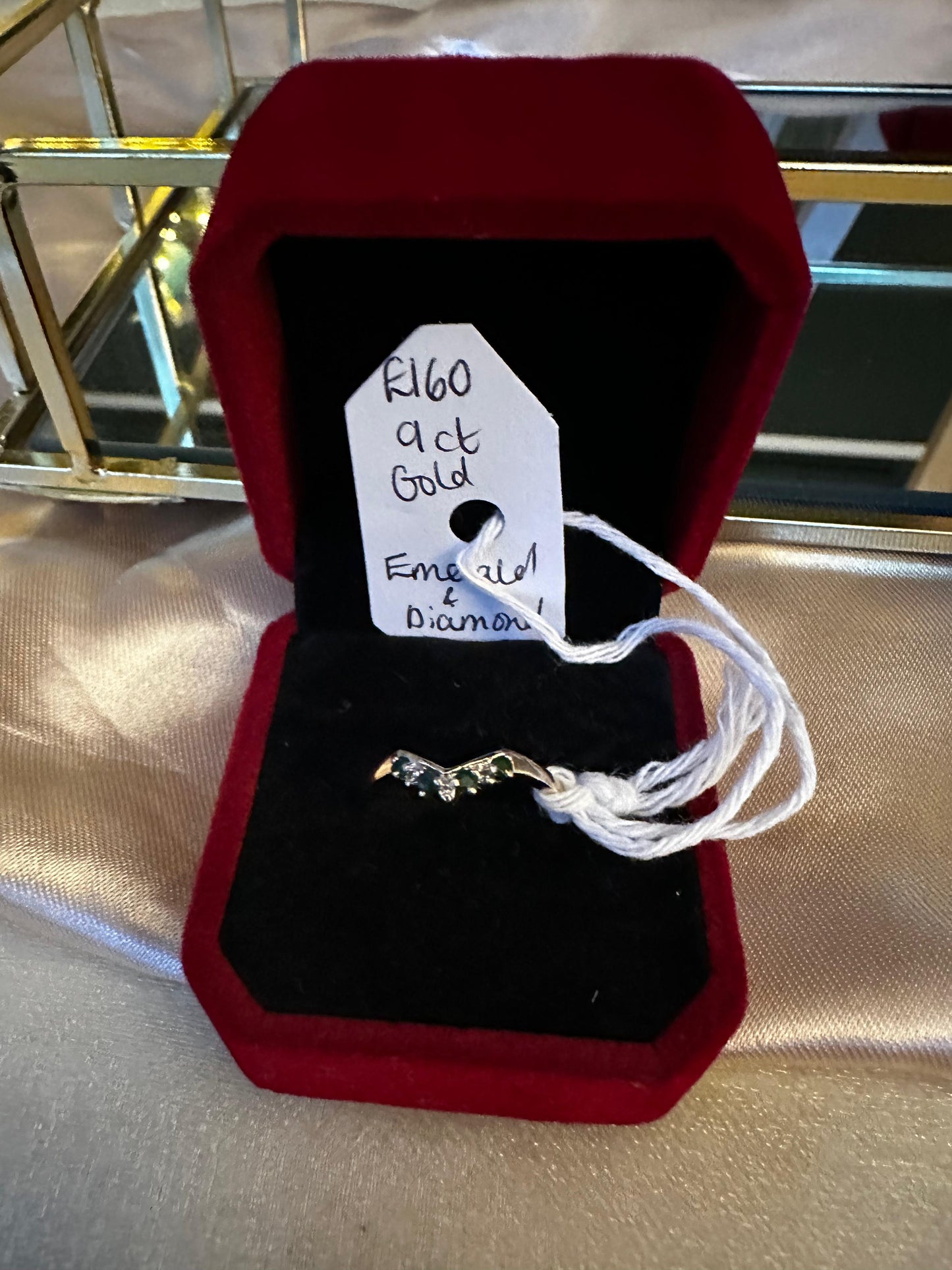 Emerald and diamond wishbone
